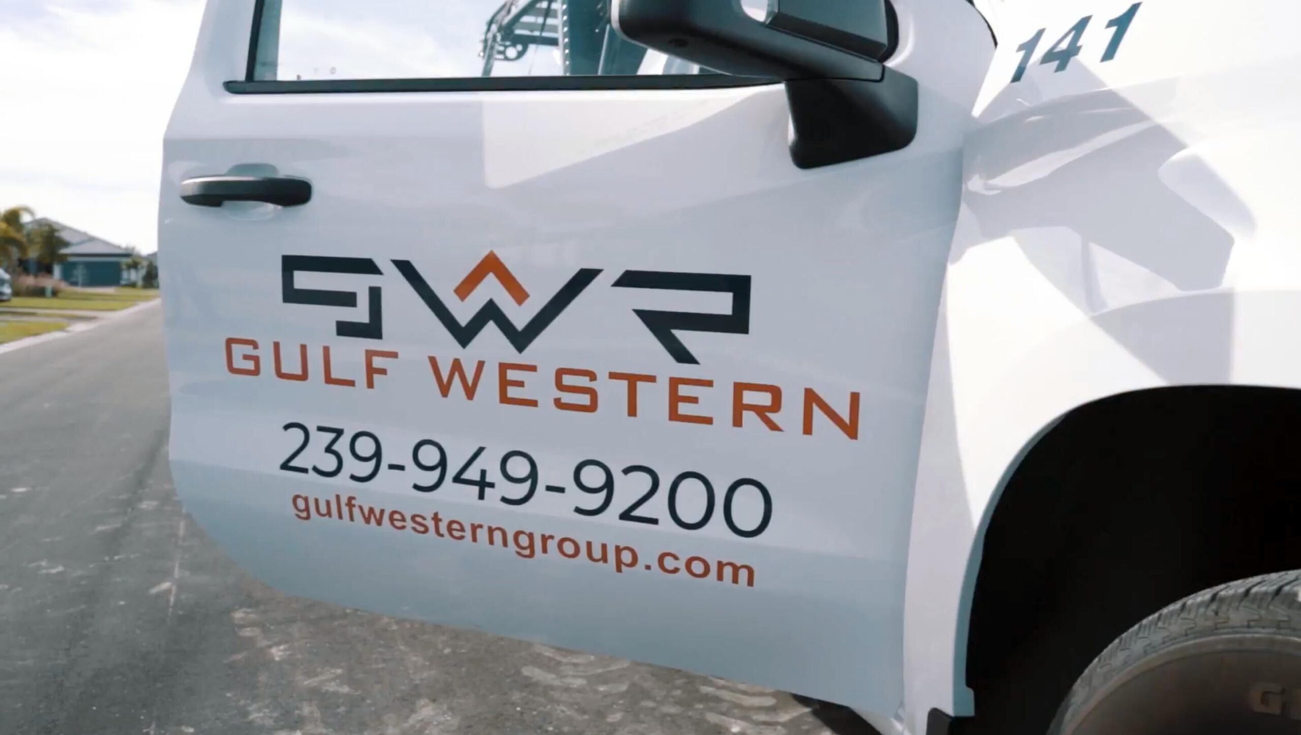 gulf western roofing - truck door - roofers florida
